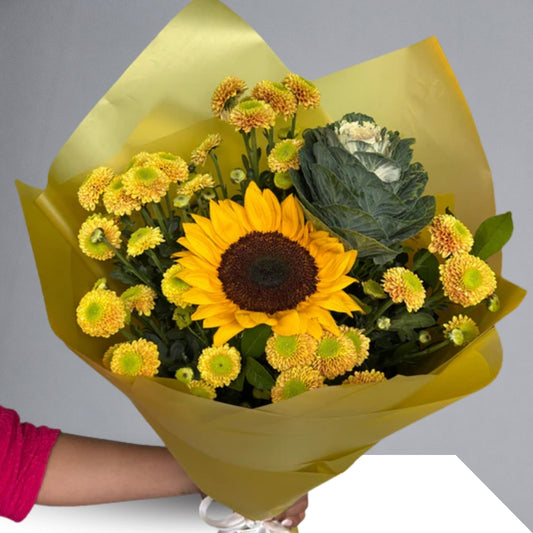 Featuring sunflowers, known for their radiant beauty and symbolic meanings of adoration and loyalty, this bouquet is a heartwarming expression of positivity and love.