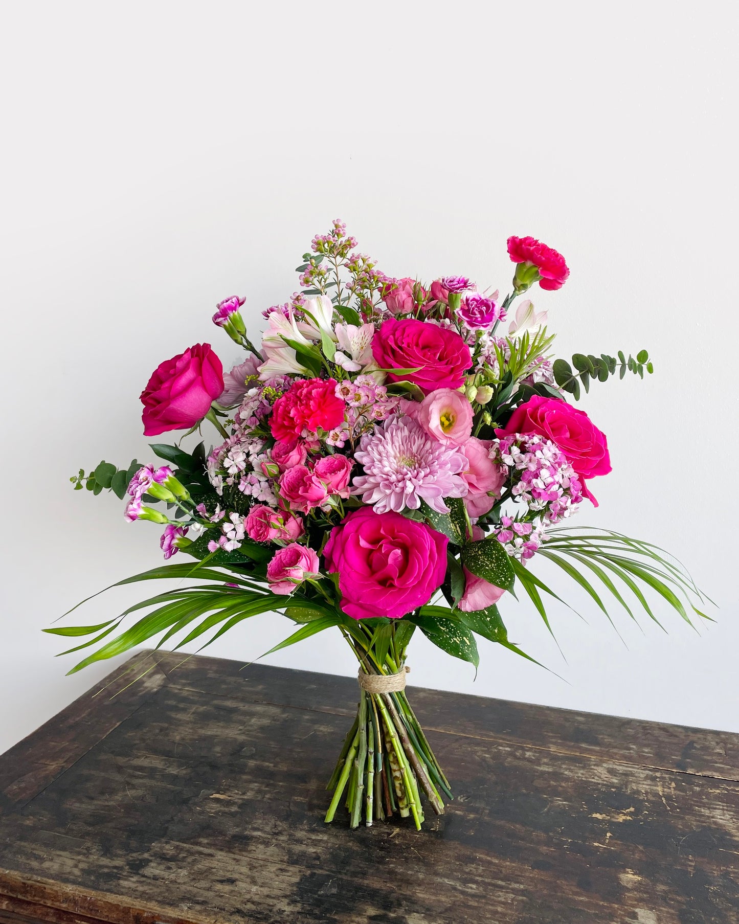 A graceful ensemble of roses, carnations, eustoma (lisianthus), wax flowers, and orchids—this bouquet is a poetic expression of elegance and affection. With delicate textures and romantic tones, it’s the perfect gift for moments that deserve something truly special.