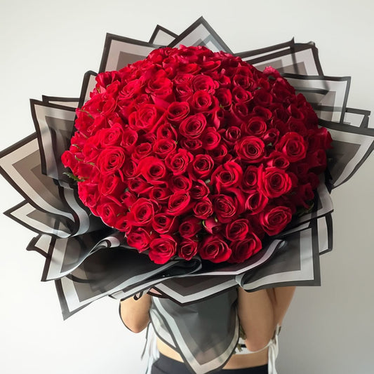 Overflowing with romance, this grand bouquet of 220-230 roses is the ultimate declaration of love and devotion. Each velvety bloom is carefully arranged to create an unforgettable floral masterpiece, making it the perfect choice for momentous occasions and heartfelt gestures.